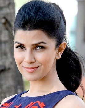 Nimrat Kaur as News Anchor Interviewer