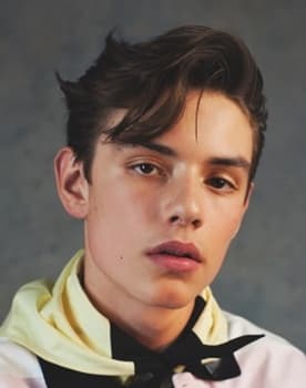 Louis Partridge as 