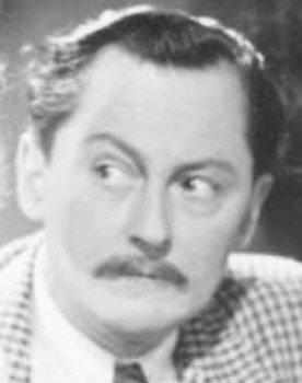 Lutz Götz as Oberlehrer Dr. Brett