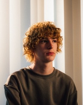 Zachary Colmenero as John Williams