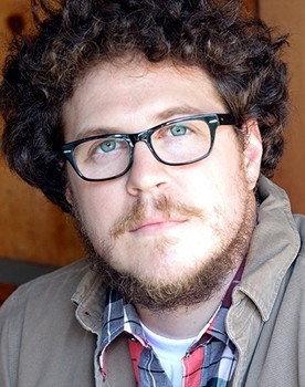 Cameron Britton as 