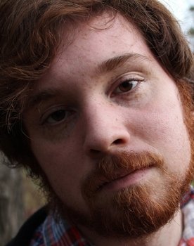 Zachary Steere as Dinosaur Suit Performer