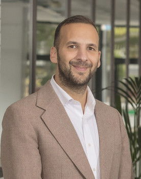 Zack Polanski as Travis Carter