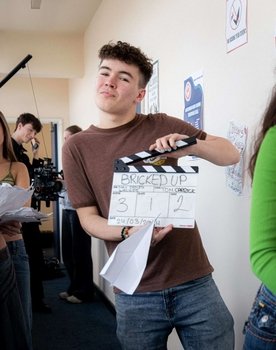Sam Liddell as Podcast Host 2