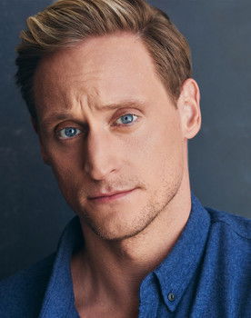 Nathaniel Dolquist as Trainer