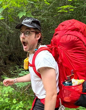 Samuel Letnik as The Man in Many Suits
