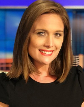 Meghan Packer as TV Anchor