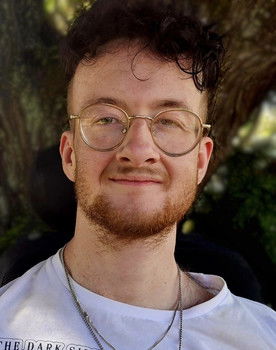 Jess Stewart as Weather Announcer / Voice (Cameo)