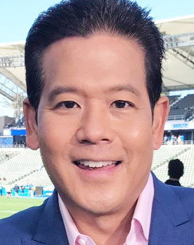 Rob Fukuzaki as Game Commentator (voice)