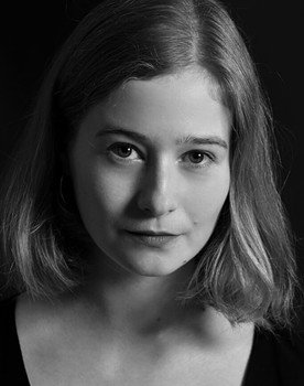 Ági Bartos as hostess