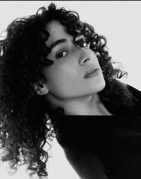 Suhaila Farag as The Woman