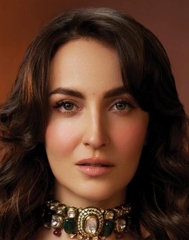 Elli Avram as Madhuri Pinto