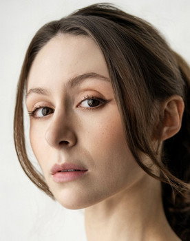 Courtney Mirelle as Newscaster