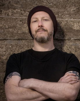 Michael McKeegan as Bass