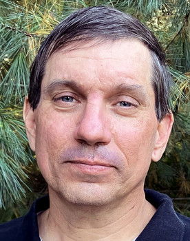 Joe Hornacek as The Guy with the Big Hat and Sunglasses