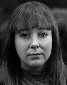 Charlie Clarke as Carol from HR