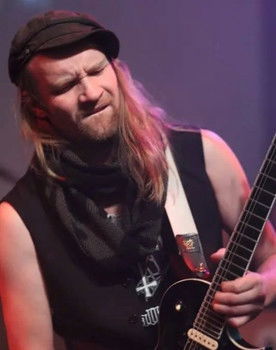 Magnus Henriksson as Guitar / Background Vocals