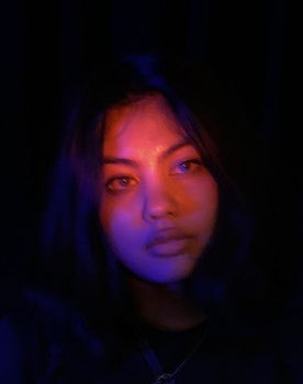 Charlize Younglove as The Woman