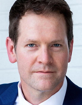 Mark E. Holmes as Father Elias