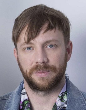 Ben McKee as The Witness