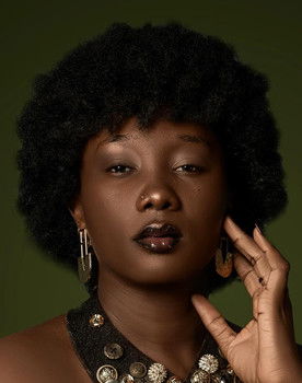 Brigitte Tchanégué as Aïcha