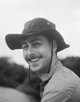 Sebastian White as The Fisherman