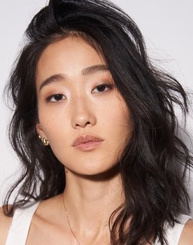 Andie Ju as Doumi (uncredited)