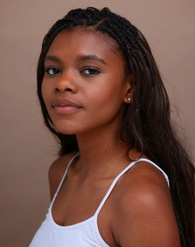 Chloé Flowers as Maya