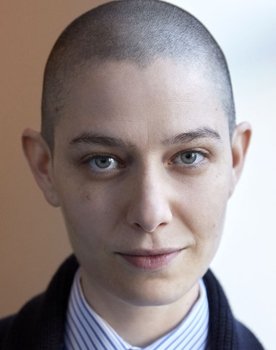 Asia Kate Dillon as The Adjudicator