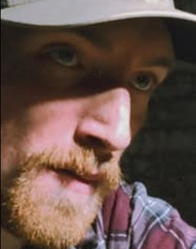 Charlie Slater as The Mysterious Man