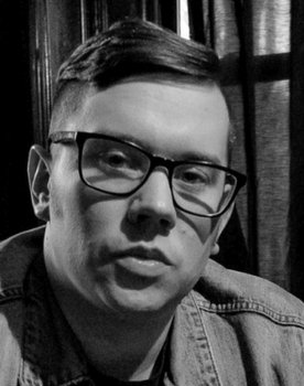 Jason Zink as Protest Leader's Assistant