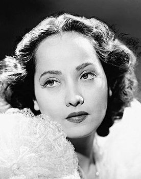 Merle Oberon as Karin Touzac