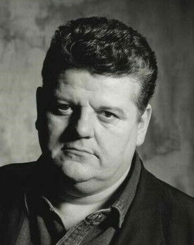 Robbie Coltrane as Curator
