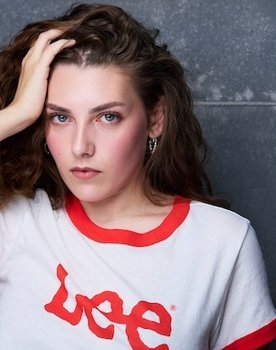 Elena DeLuca as Adrienne