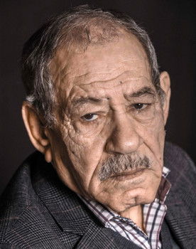 Ahmed Benaissa as Raji, "godfather" of the estate