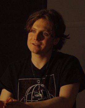 Sam Pollock as Person on TV