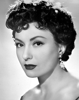 Viviane Romance as Mireille, the French wife