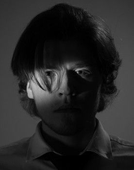 Nikolai Antonov as The Photographer