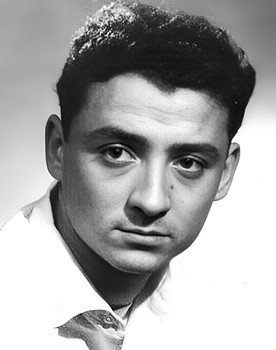 Claude Brasseur as L'enfoiré / The dumb