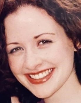 Kelly Mealia as Woman at Elaine's