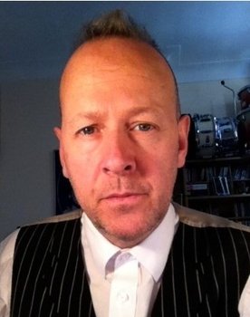 Simon Hanson as Drums