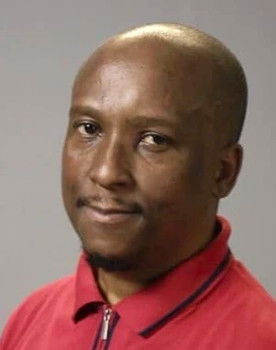 Bonginkosi Twala as Black Guy in Pub