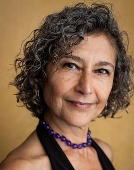 Badria Timimi as Dean Jean Bruzzi