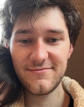 Caelan Nicol as Background Voice