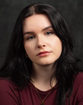 Lauren Ash-Byrne as Voice on TV 1