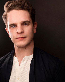 William Champion as The Organizer