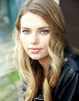 Indiana Evans as Tatum Novak
