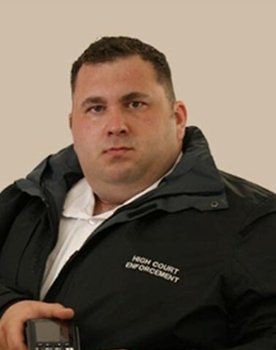 James King as Enforcement Agent