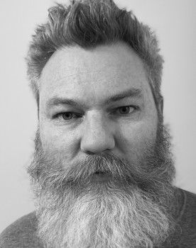 Jeremy Young as Father Traveler