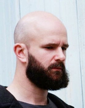 Charles Cave as Bass